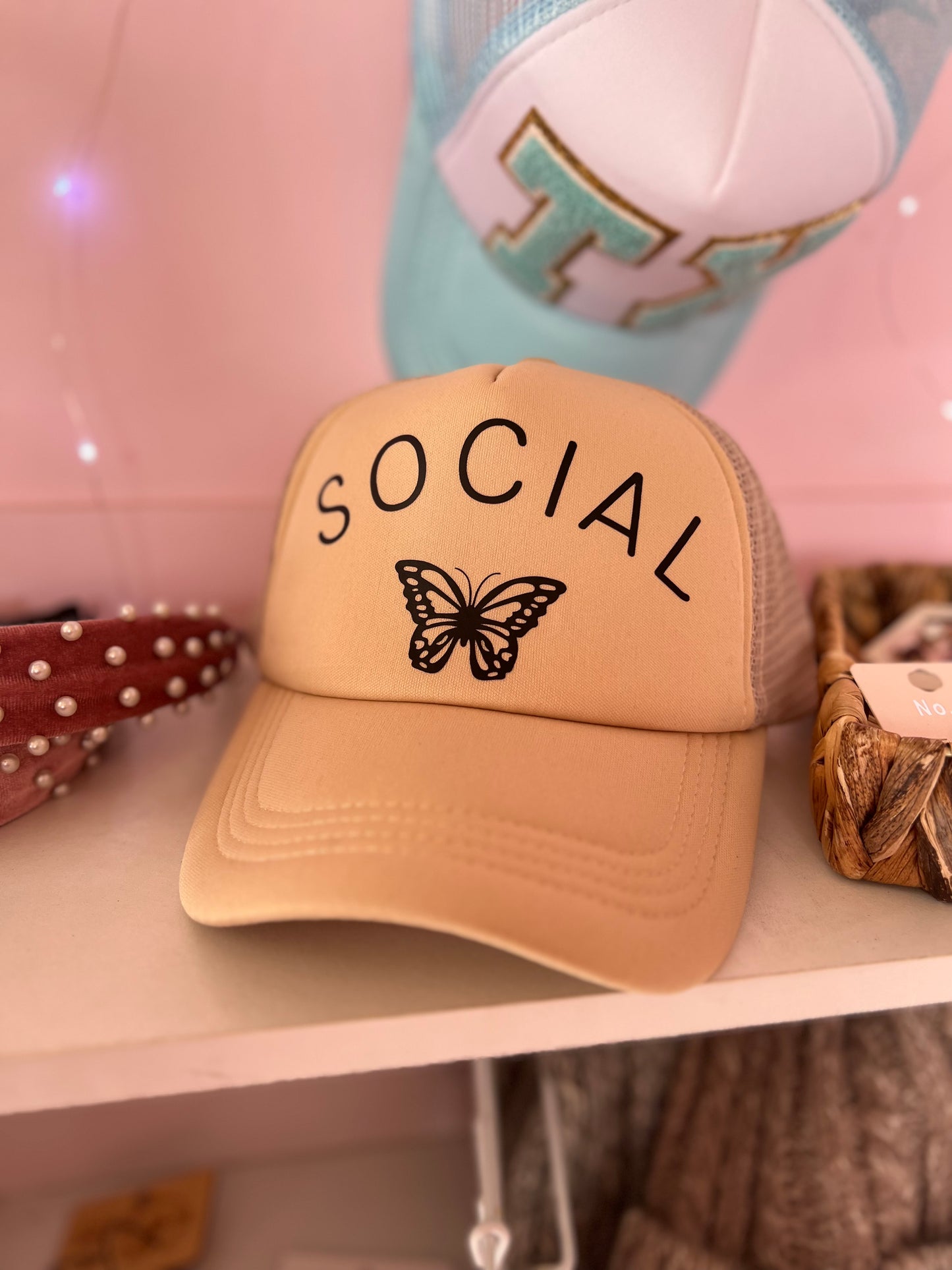 Social butterfly trucker hat